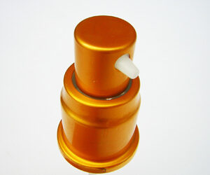 A gold coloured pump for cosmetics and personal care serum and lotion dispensing. Product code is SNXC02008
