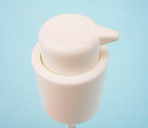 White plastic example of a SNXC050 Personal care cosmetic pump with a narrow hole for dispensing.