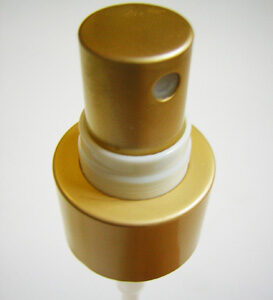 Gold fine mist sprayer top with a white band securing to a gold plastic base.