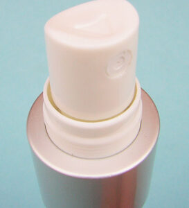SNXS15 Finger sprayer pump manufactured by ScopeNext. White plastic with a matte silver base to secure to the container.