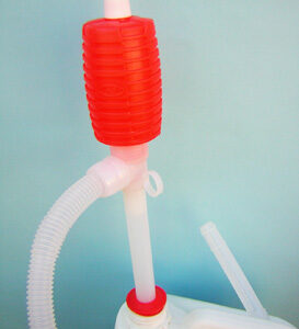 snxsp602 syphon pump a plastic tube with a barrel shaped syphon attachment and distribution hose.